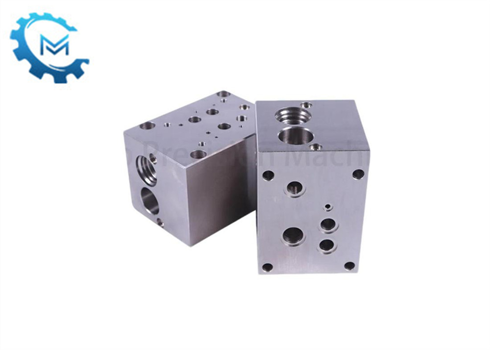 Quelles sont les fonctions de chaque port dans le bloc de valve hydraulique?